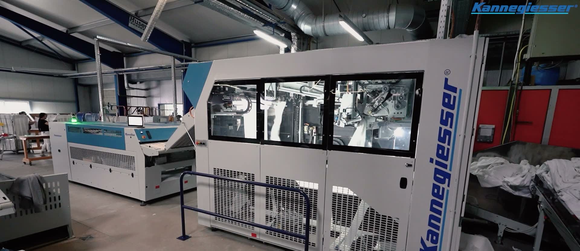 A Kannegiesser automated folding machine on the production line